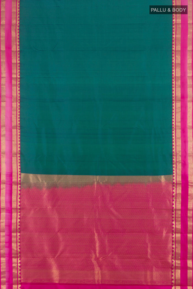 Flat view of Peacock Blue Kanchipuram Silk Saree with Zari Butta on the body and Silk Border. 