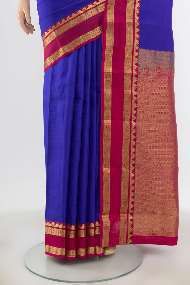 Pleats and pallu of Dark Blue Kanchipuram Silk Saree with Zari Butta on the body and Silk Border. 