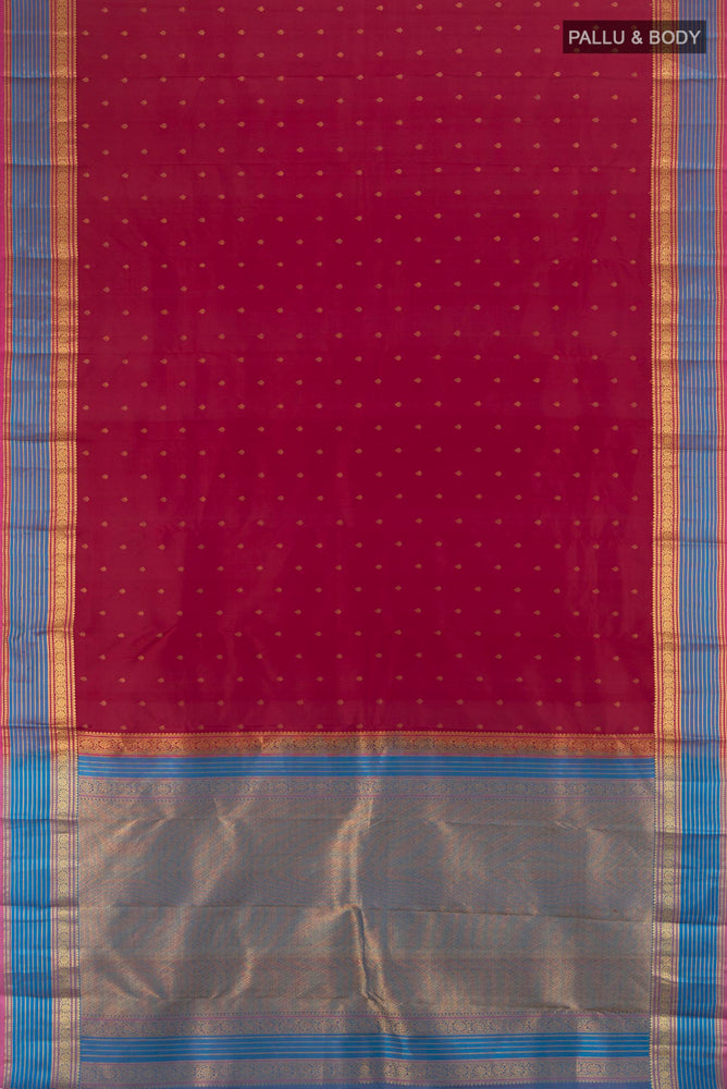 Flat view of Maroon Kanchipuram Silk Saree with Zari Butta on the body and Silk Border. 
