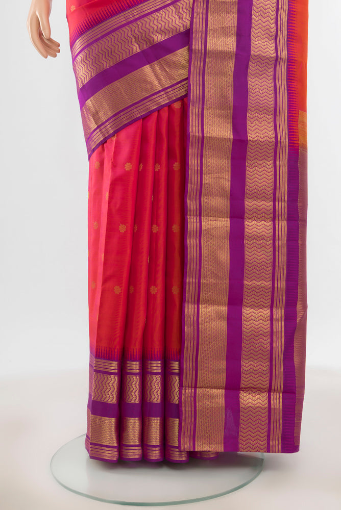 Pleats and pallu of Pure Silk Pure Zari Peach Kanjivaram Saree with Zari Butta on the body and Silk Border. 