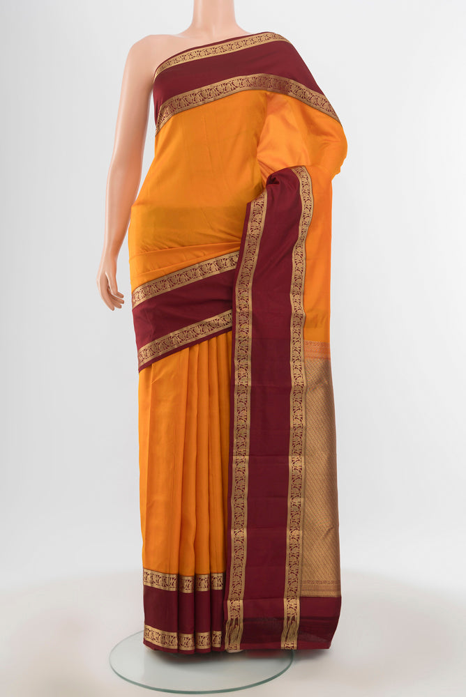 Pure Silk Pure Zari Yellow Kanchipuram Saree with Plain Body and Silk Border.  displayed on a mannequin