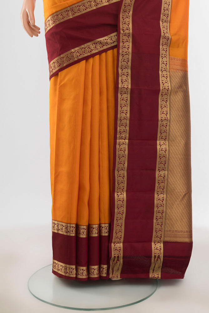 Pleats and pallu of Pure Silk Pure Zari Yellow Kanchipuram Saree with Plain Body and Silk Border. 