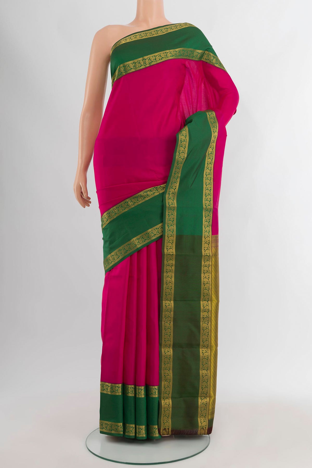 Dark Pink Kanchipuram Silk Saree with Zari Butta on the body and Zari Border.  displayed on a mannequin