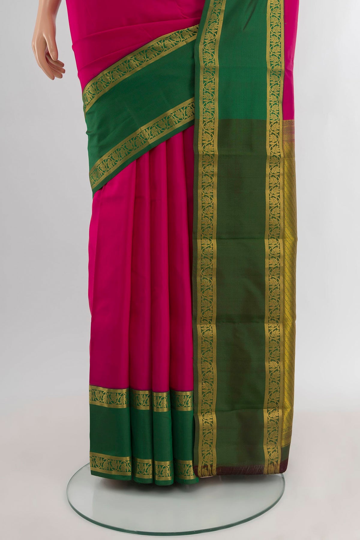 Pleats and pallu of Dark Pink Kanchipuram Silk Saree with Zari Butta on the body and Zari Border. 