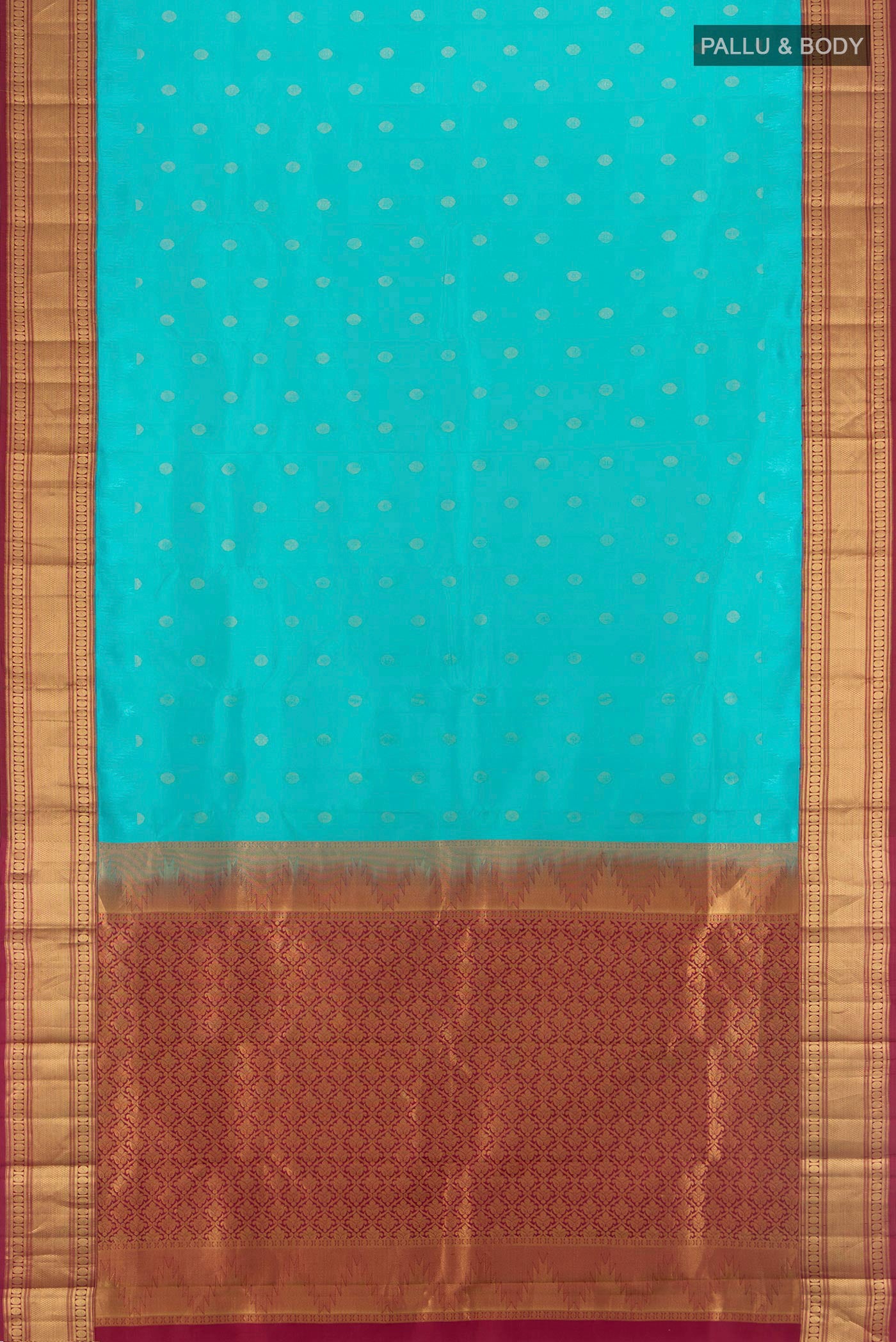 Flat view of Light Blue Kanchipuram Silk Saree with Zari Butta on the body and Zari Border. 