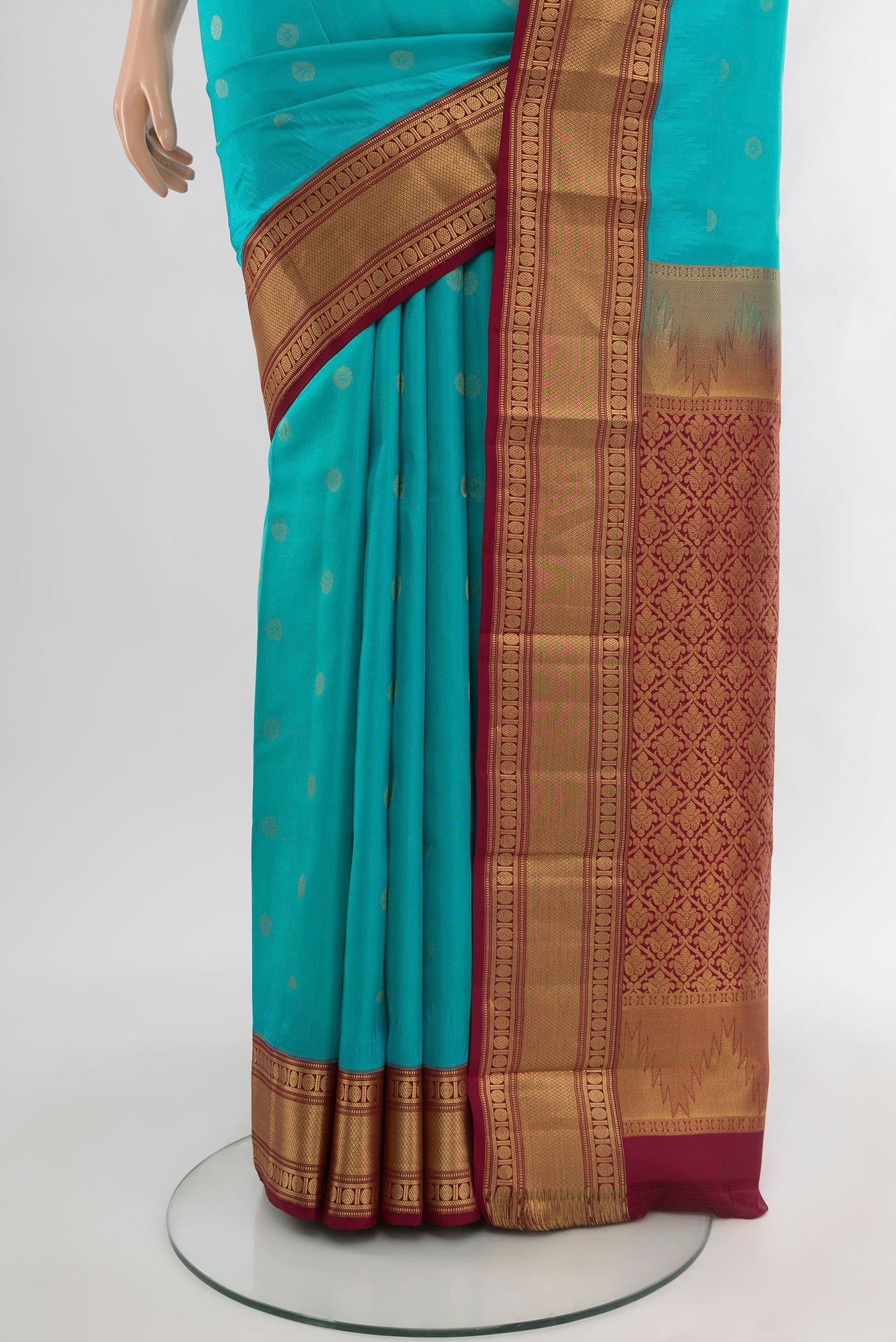Pleats and pallu of Light Blue Kanchipuram Silk Saree with Zari Butta on the body and Zari Border. 