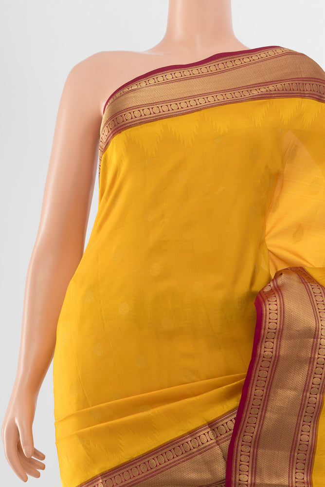 Border image of Pure Silk Pure Zari Mustard Kanchipuram Saree with Zari Butta on the body and Silk Border. 