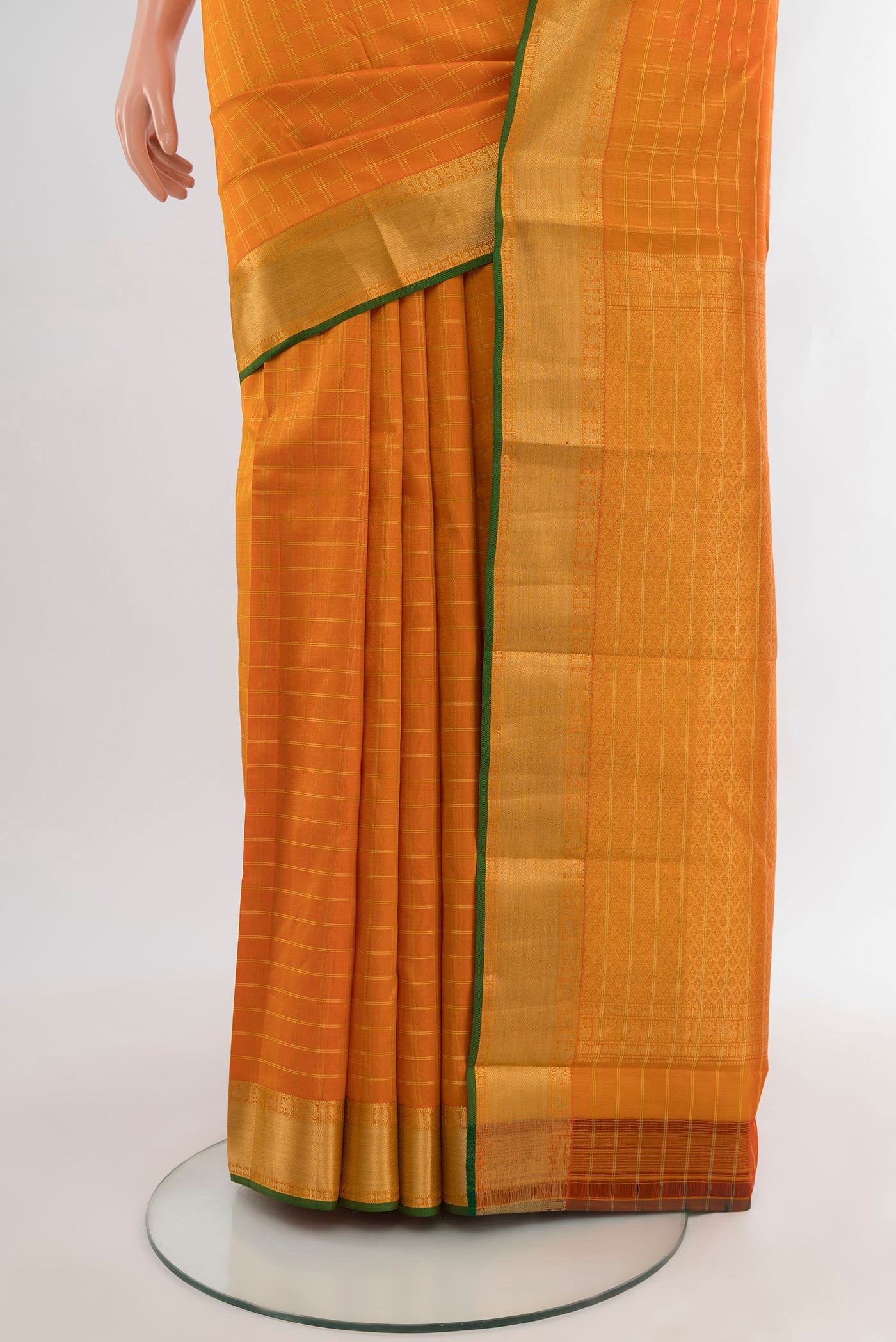 Pleats and pallu of Orange Kanchipuram Silk Saree with Checked design on the body and Zari Border. 