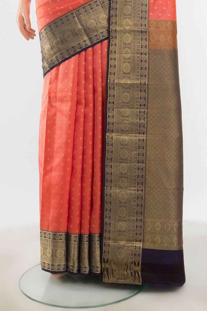 Pleats and pallu of Rose Gold Kanchipuram Silk Saree with Zari Butta on the body and Silk Border. 