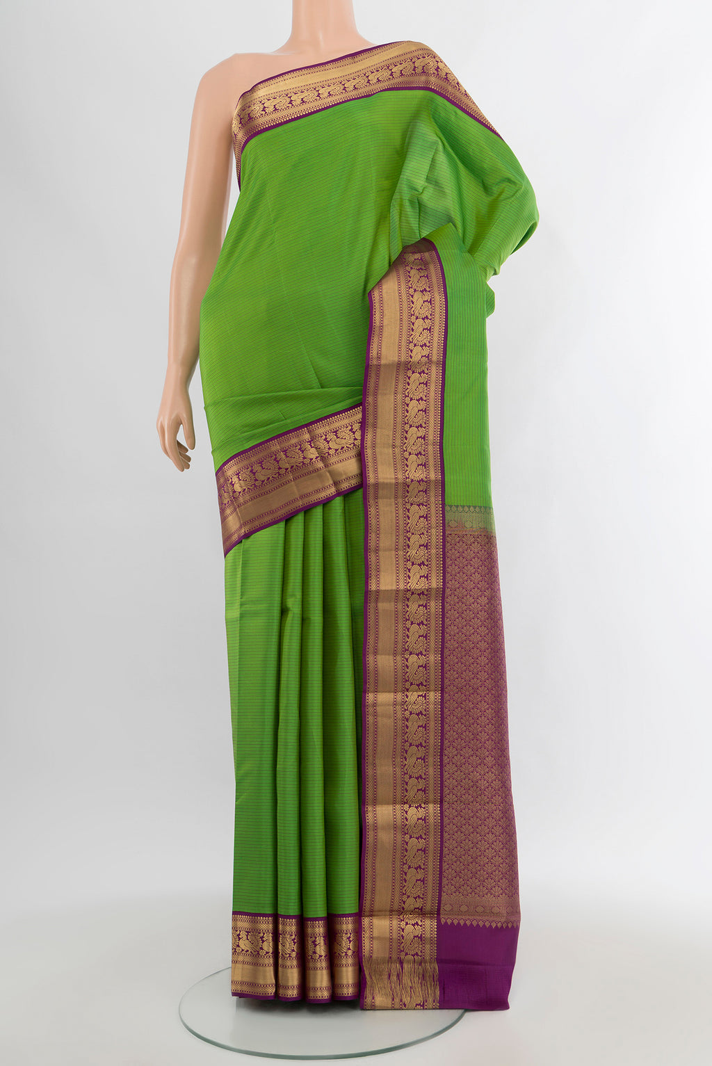 Light Green Kanchipuram Silk Saree with Stripes on the body and Zari Border.  displayed on a mannequin