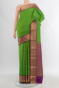 Light Green Kanchipuram Silk Saree with Stripes on the body and Zari Border.  displayed on a mannequin