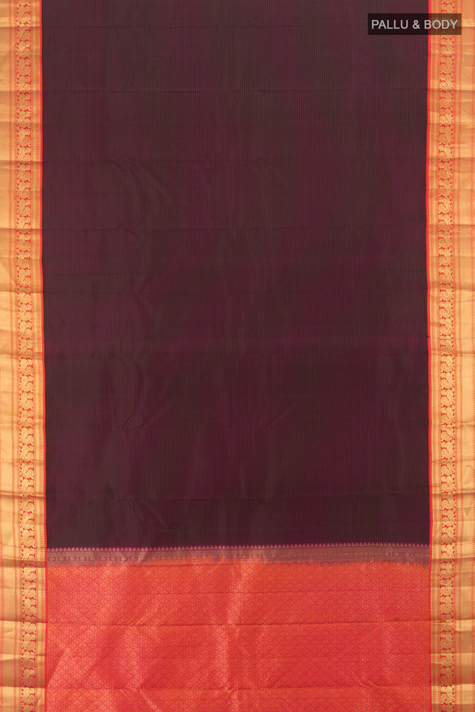 Flat view of Brown Kanchipuram Silk Saree with Zari Butta on the body and Silk Border. 