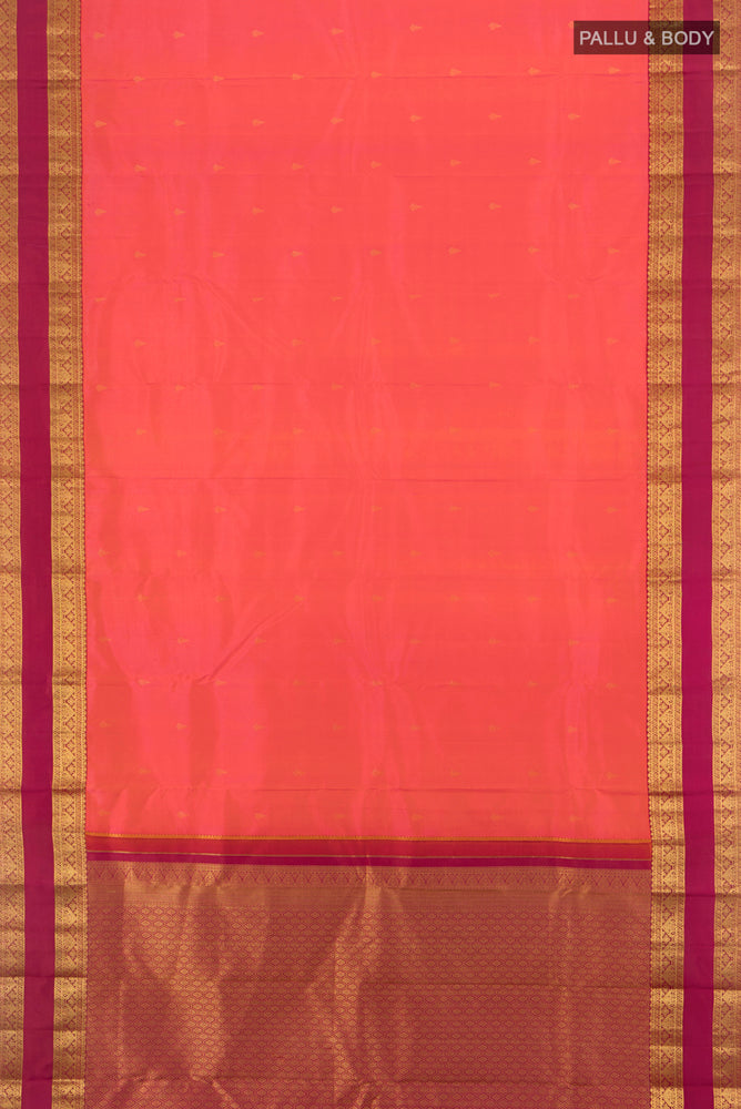 Flat view of Pure Silk Pure Zari Peach Kanchipuram Saree with Zari Butta on the body and Silk Border. 