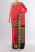 Pure Silk Coral Kanchipuram Saree with Zari Butta on the body and Zari Border.  displayed on a mannequin
