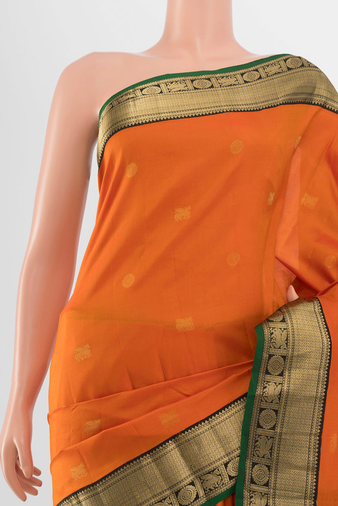 Border image of Brick Orange Kanchipuram Silk Saree with Zari Butta on the body and Silk Border. 