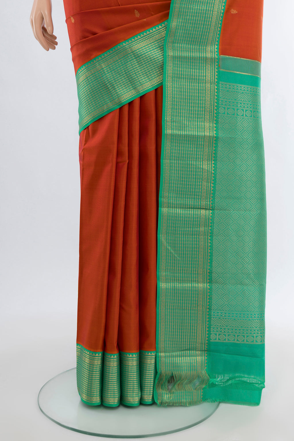 Pleats and pallu of Peach Kanchipuram Silk Saree with Zari Butta on the body and Silk Border. 