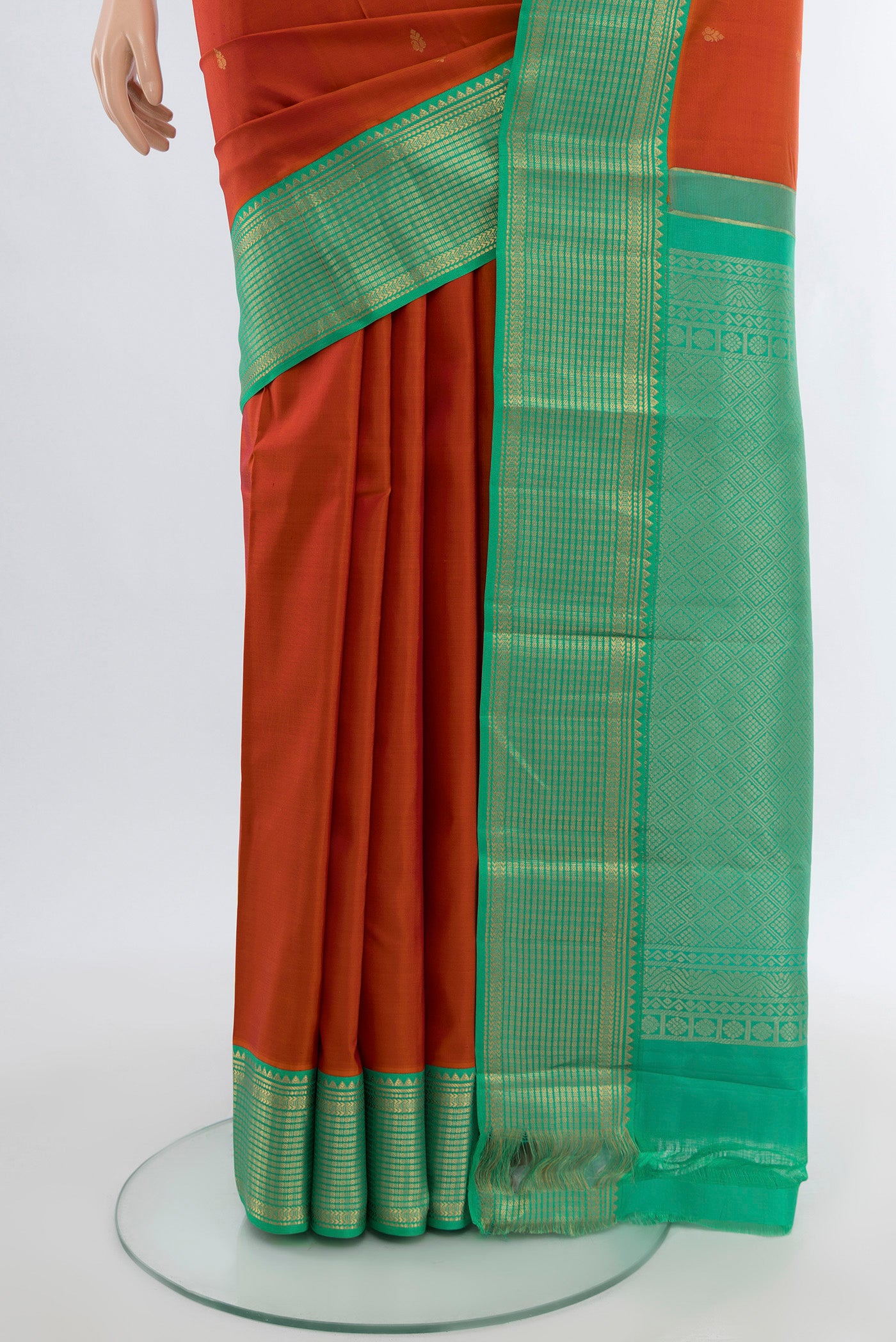 Pleats and pallu of Peach Kanchipuram Silk Saree with Zari Butta on the body and Silk Border. 