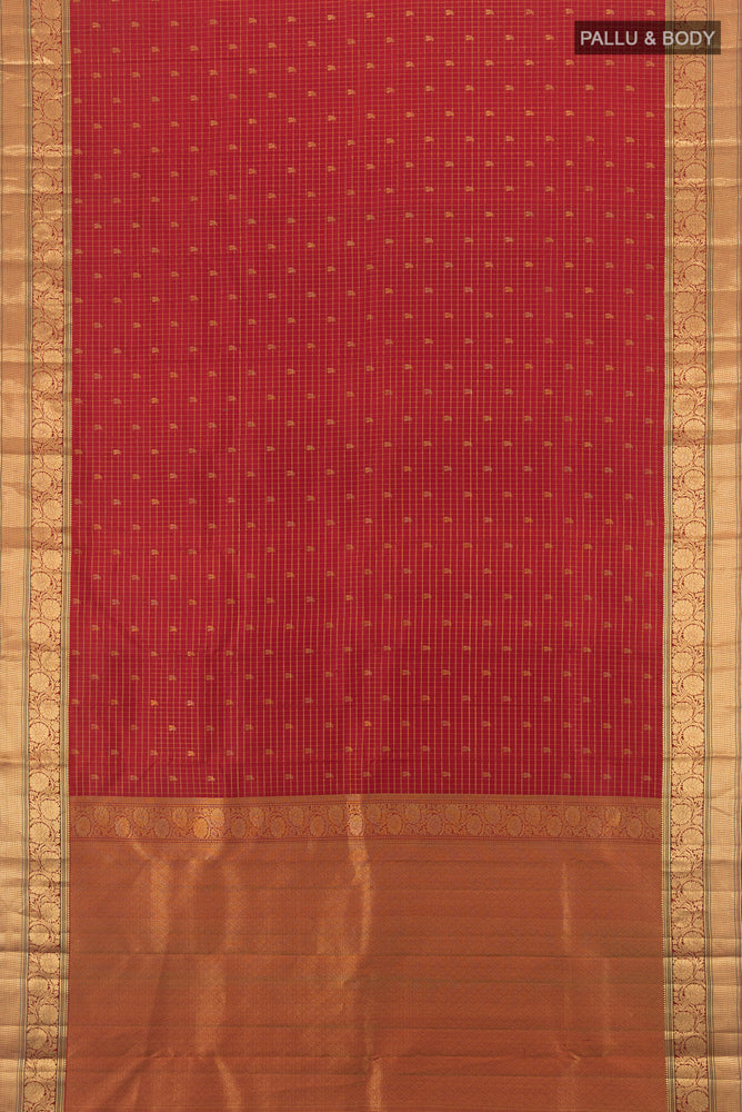 Flat view of Pure Silk Pure Zari Maroon Kanchipuram Saree with Zari Butta on the body and Silk Border. 