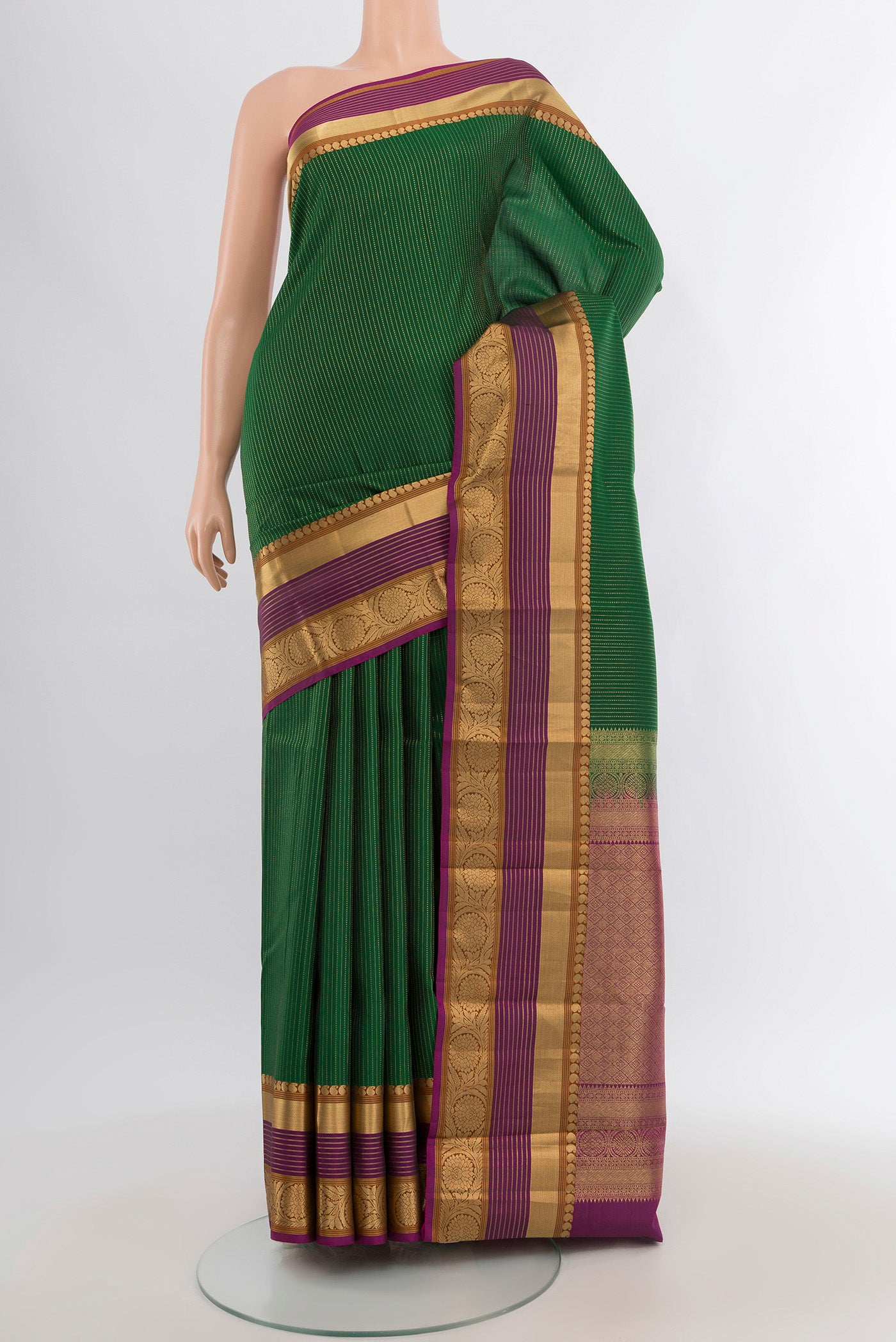 Bottle Green Kanjivaram Silk Saree with Stripes on the body and Zari Border.  displayed on a mannequin