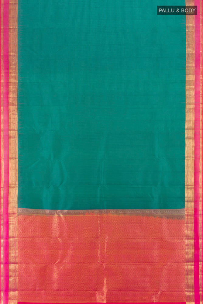 Flat view of Peacock Blue Kanchipuram Silk Saree with Zari Brocade on the body and Silk Border. 