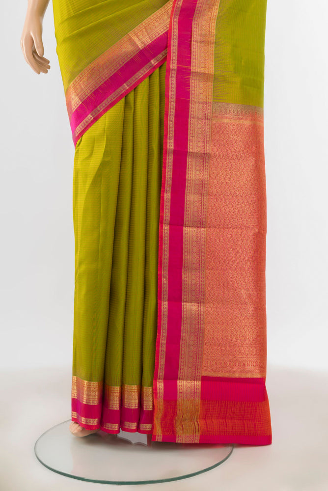 Pleats and pallu of Light Green Kanchipuram Silk Saree with Zari Butta on the body and Silk Border. 
