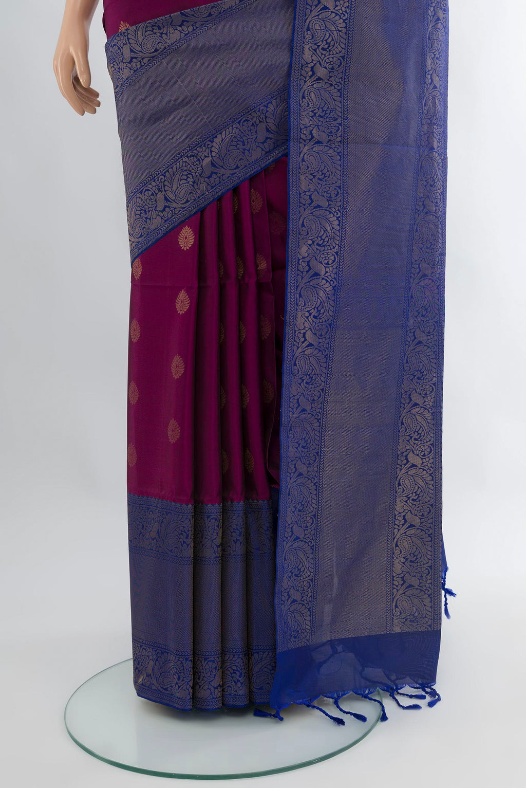 Pleats and pallu of Purple Soft Silk Saree with Zari Butta on the body and One Side Border. 