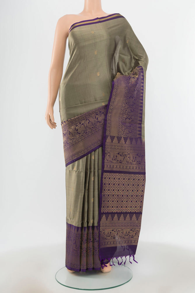 Pure Silk Pure Zari Grey Soft Saree with Zari Butta on the body and Silk Border.  displayed on a mannequin