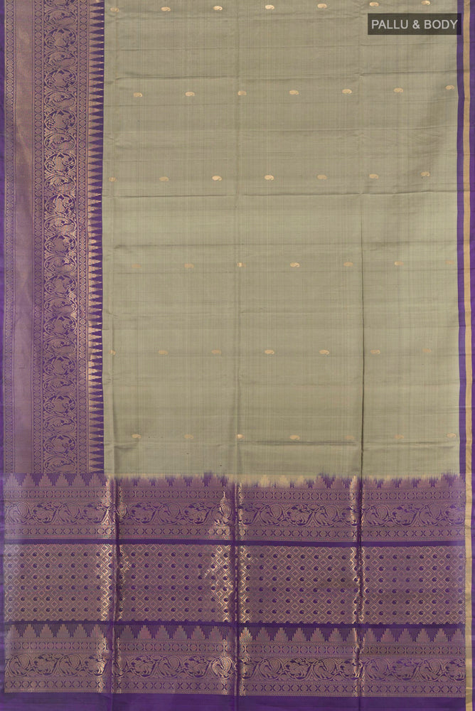 Flat view of Pure Silk Pure Zari Grey Soft Saree with Zari Butta on the body and Silk Border. 