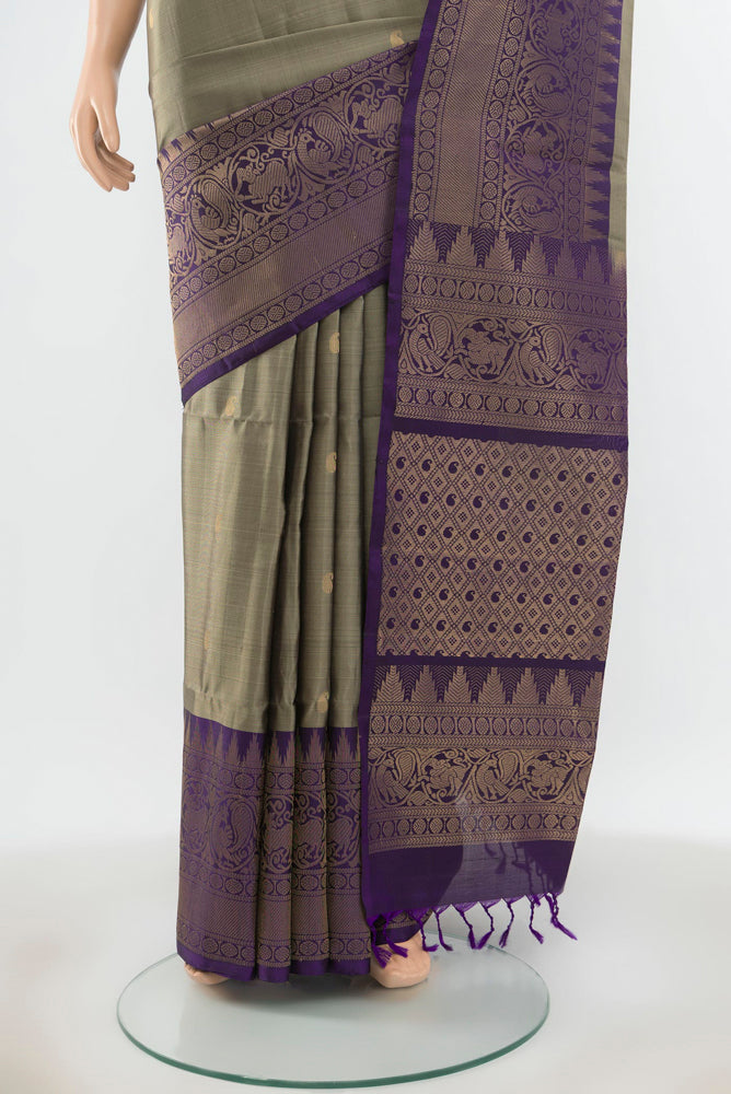 Pleats and pallu of Pure Silk Pure Zari Grey Soft Saree with Zari Butta on the body and Silk Border. 