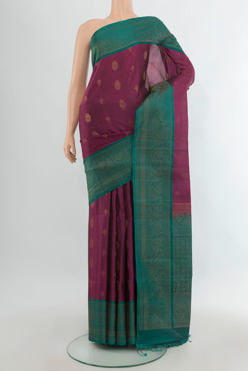 Pure Silk Purple Soft Saree with Zari Butta on the body and Fancy Border.  displayed on a mannequin