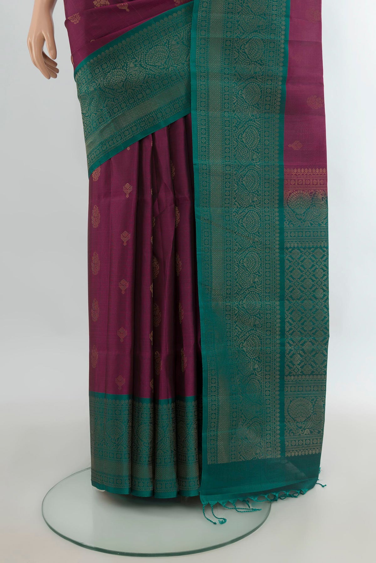 Pleats and pallu of Pure Silk Purple Soft Saree with Zari Butta on the body and Fancy Border. 
