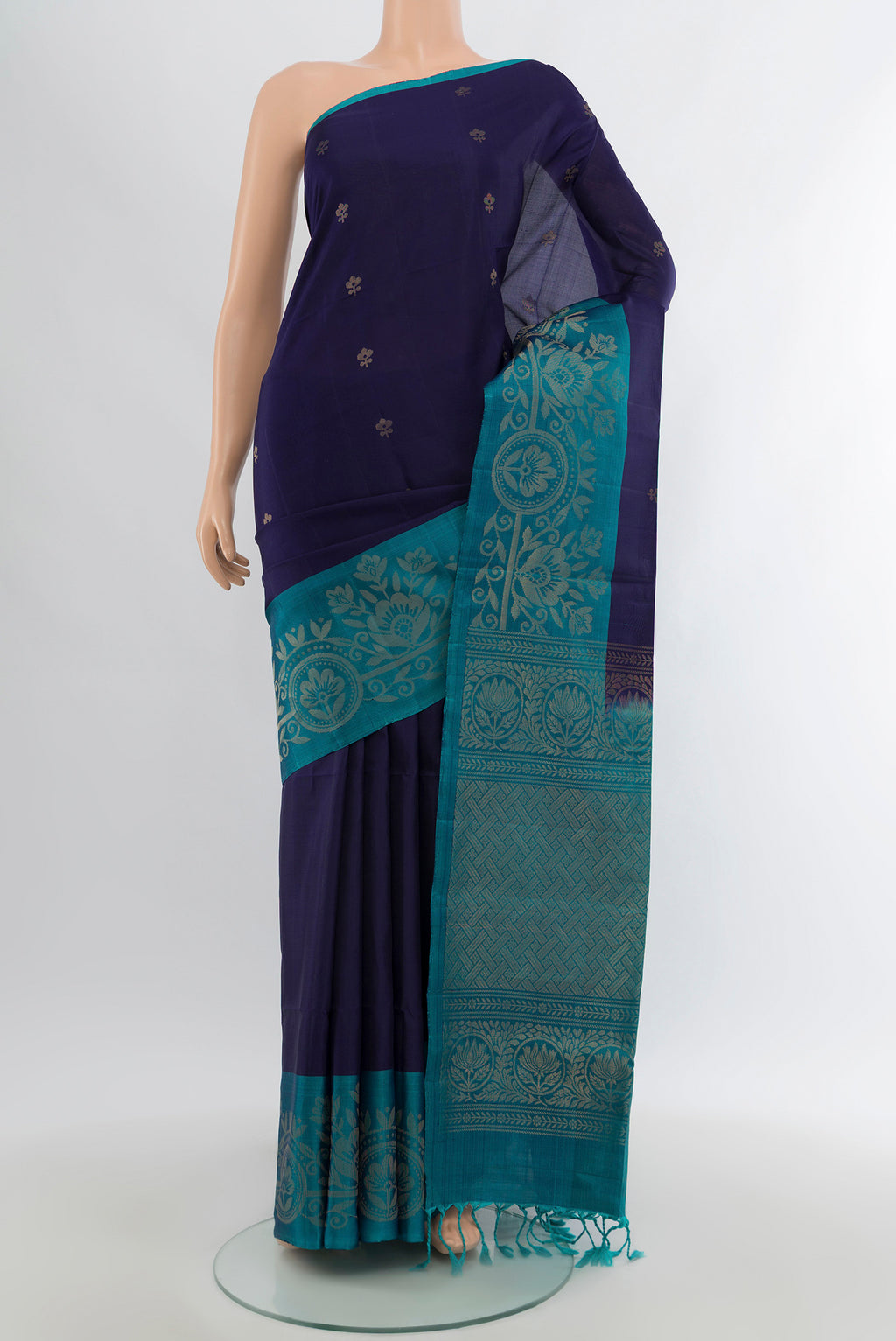 Navy Blue Soft Silk Saree with Zari Butta on the body and Fancy Border.  displayed on a mannequin