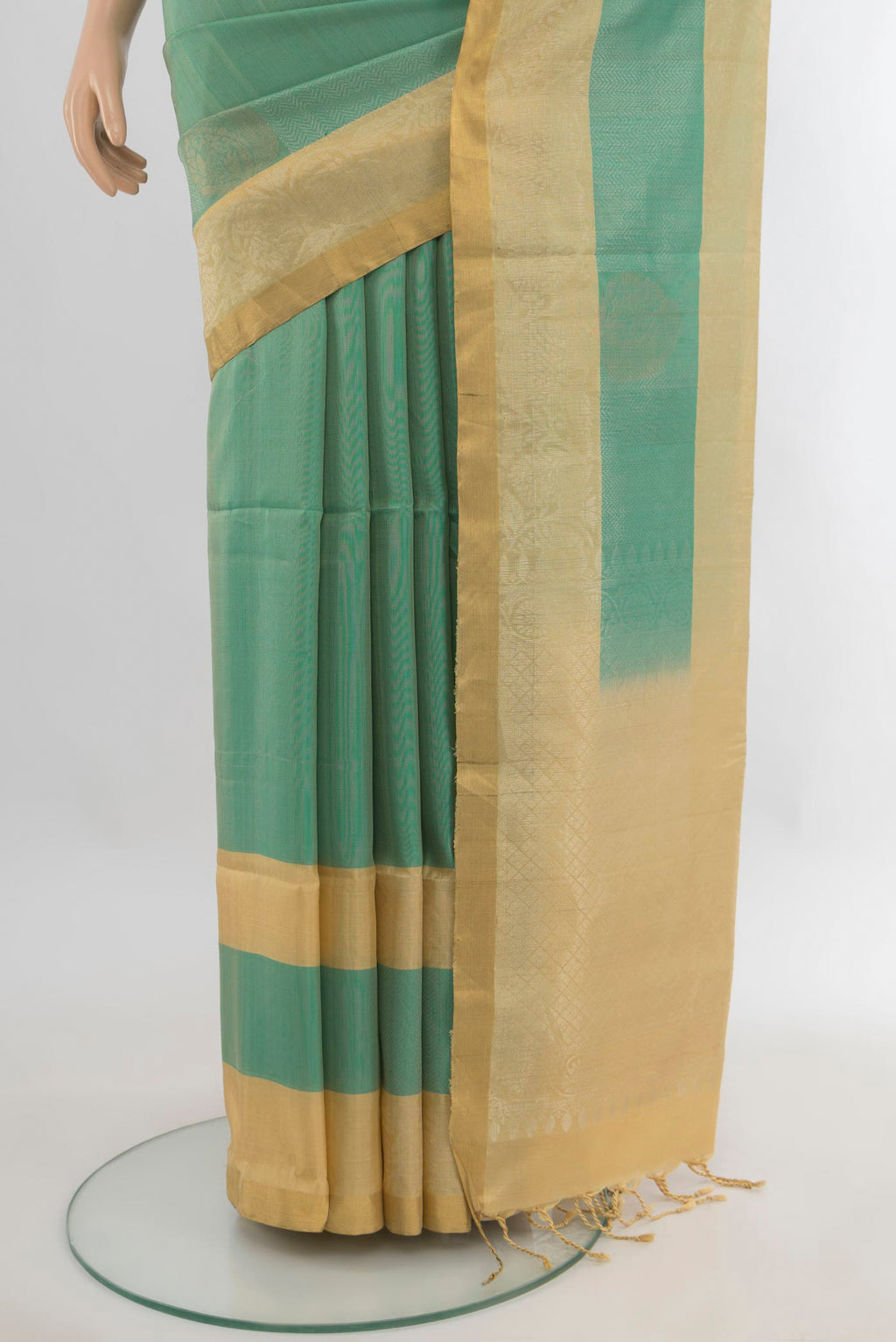 Pleats and pallu of Pure Silk Light Green Soft Saree with Zari Butta on the body and Zari Border. 