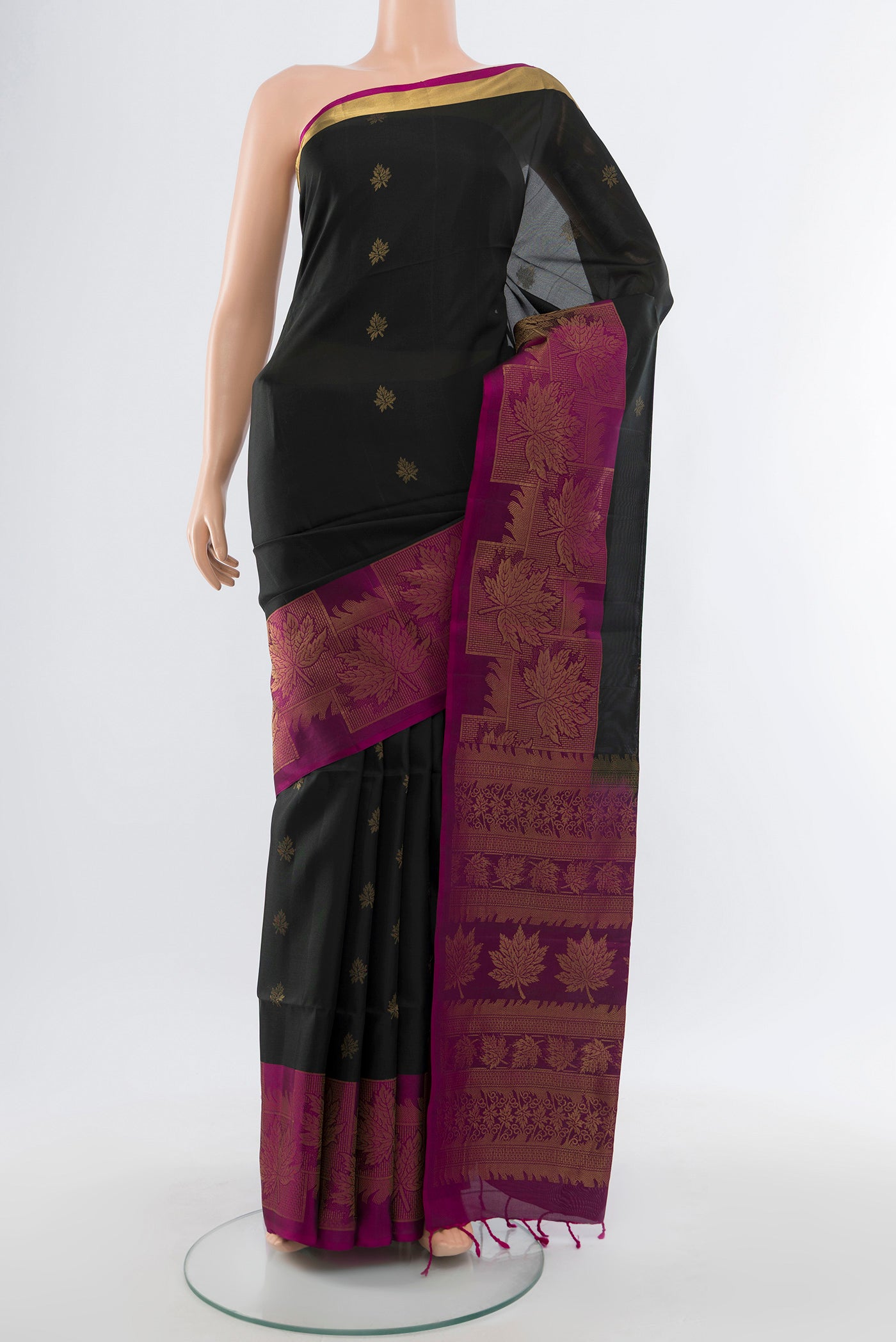 Coffee Brown Soft Silk Saree with Zari Butta on the body and Silk Border.  displayed on a mannequin