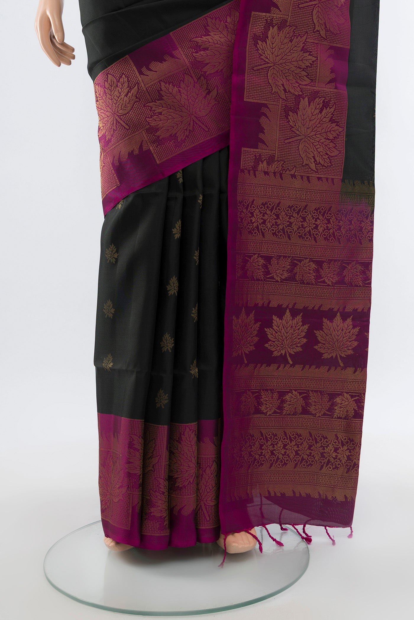 Pleats and pallu of Coffee Brown Soft Silk Saree with Zari Butta on the body and Silk Border. 
