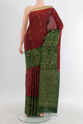 Maroon Soft Silk Saree with Zari Butta on the body and Zari Border.  displayed on a mannequin