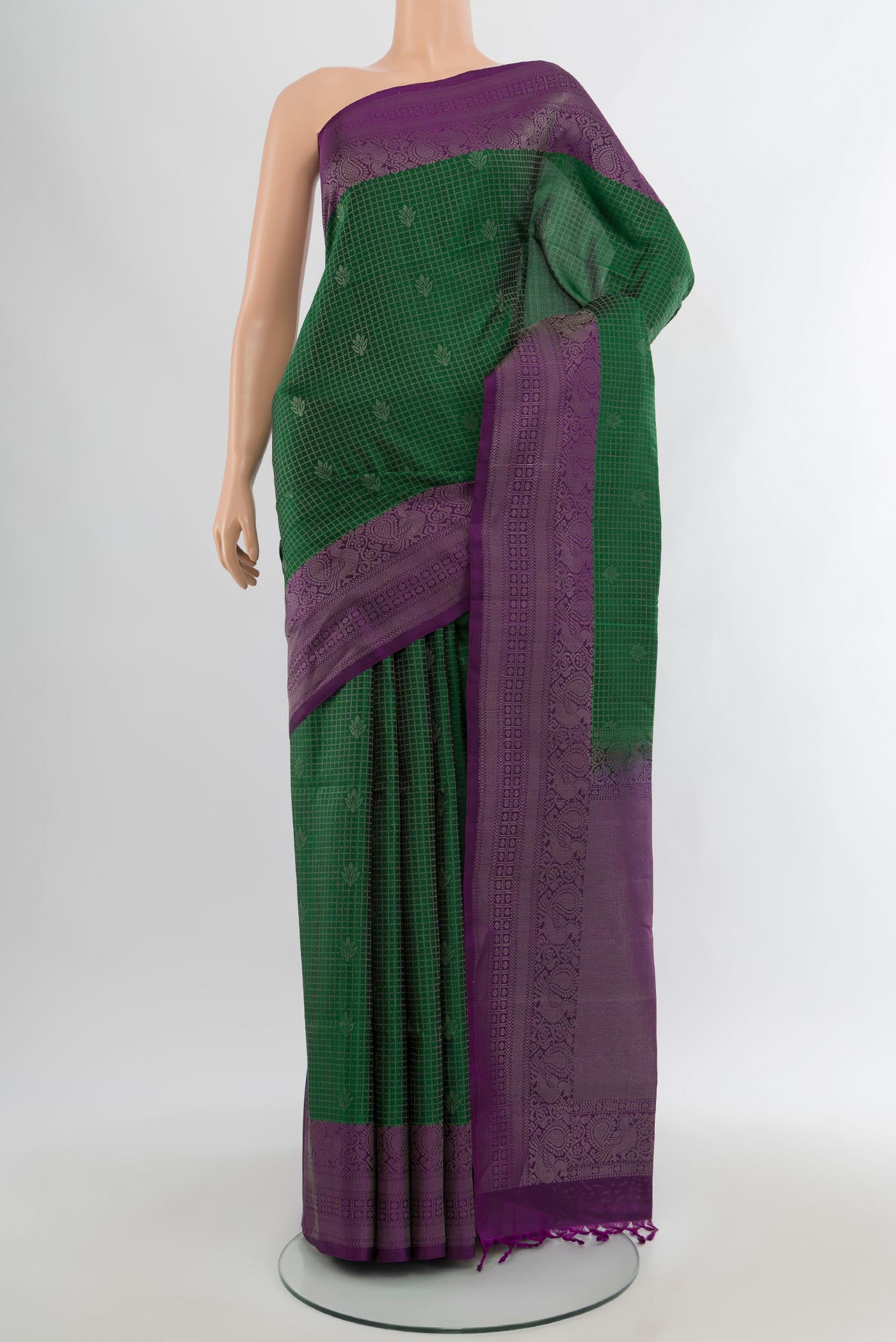 Bottle Green Soft Silk Saree with Checked design on the body and Zari Border.  displayed on a mannequin