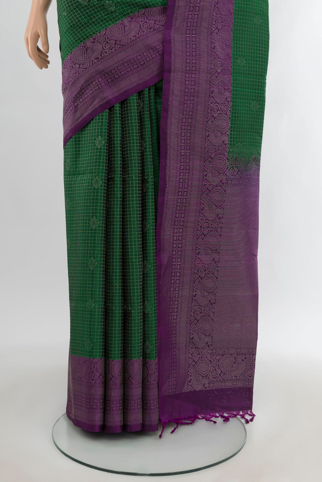 Pleats and pallu of Bottle Green Soft Silk Saree with Checked design on the body and Zari Border. 