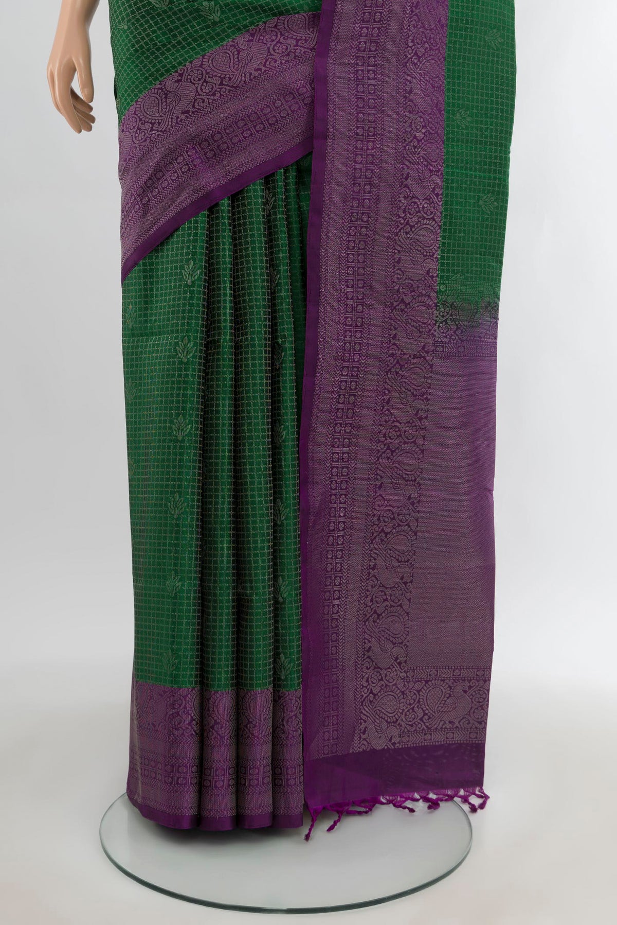 Pleats and pallu of Bottle Green Soft Silk Saree with Checked design on the body and Zari Border. 