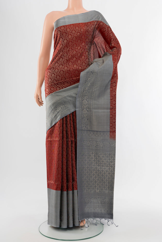 Maroon Soft Silk Saree with Zari Butta on the body and Silk Border.  displayed on a mannequin