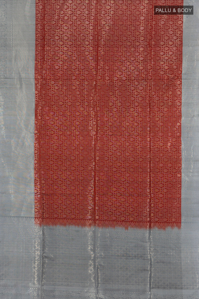Flat view of Maroon Soft Silk Saree with Zari Butta on the body and Silk Border. 