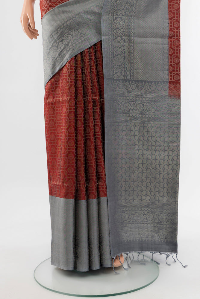 Pleats and pallu of Maroon Soft Silk Saree with Zari Butta on the body and Silk Border. 