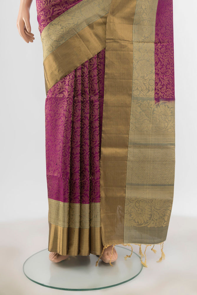 Pleats and pallu of Purple Soft Silk Saree with Zari Butta on the body and Silk Border. 