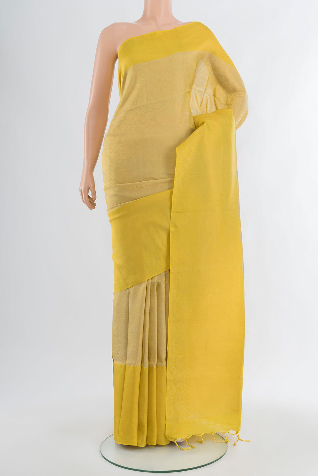 Beige Soft Silk Saree with Zari Brocade on the body and Zari Border.  displayed on a mannequin