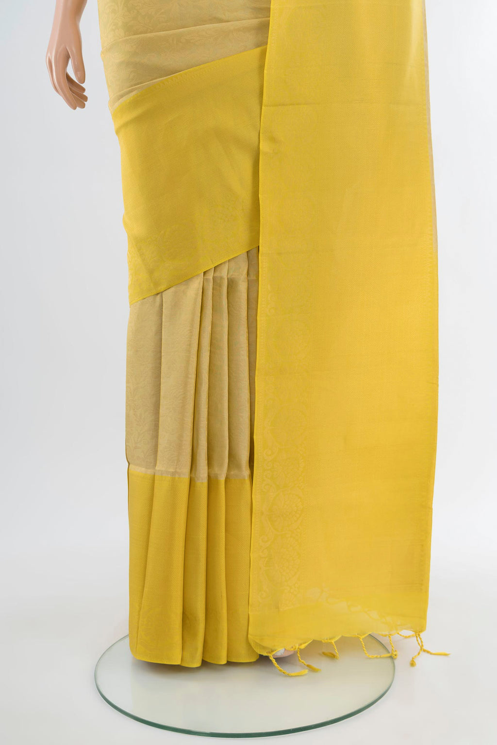Pleats and pallu of Beige Soft Silk Saree with Zari Brocade on the body and Zari Border. 
