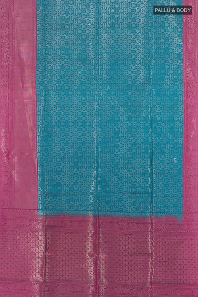 Flat view of Peacock Blue Soft Silk Saree with Zari Butta on the body and Silk Border. 