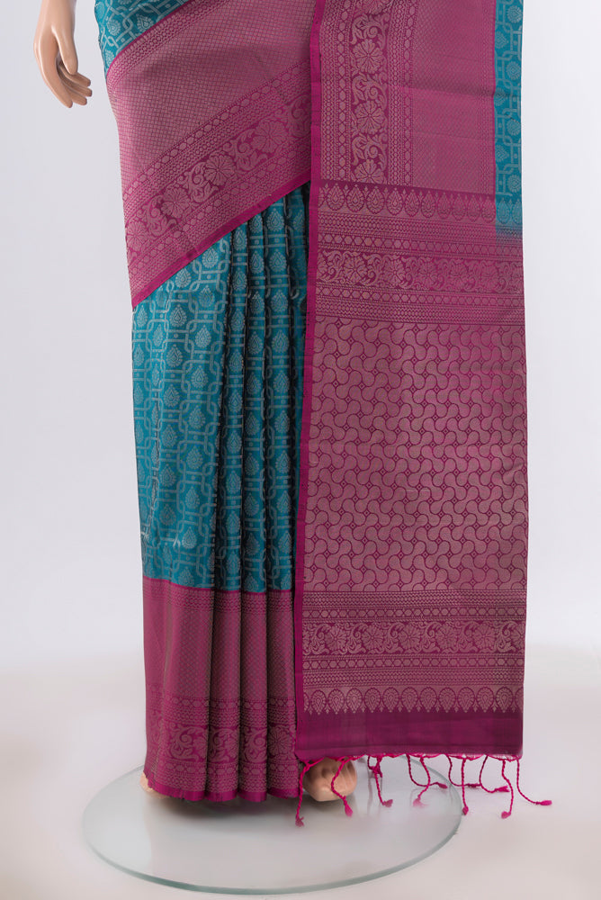 Pleats and pallu of Peacock Blue Soft Silk Saree with Zari Butta on the body and Silk Border. 