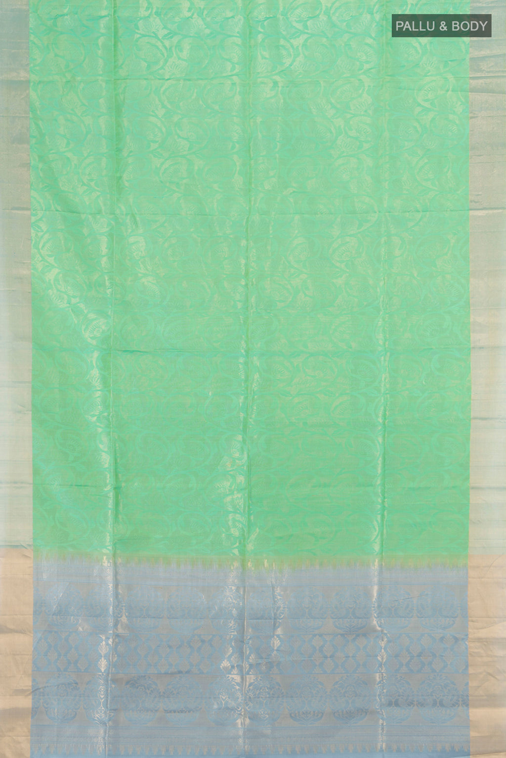 Flat view of Light Green Soft Silk Saree with Zari Butta on the body and Silk Border. 
