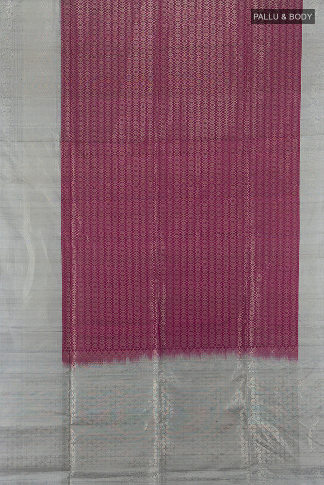 Flat view of Purple Soft Silk Saree with Zari Butta on the body and Silk Border. 
