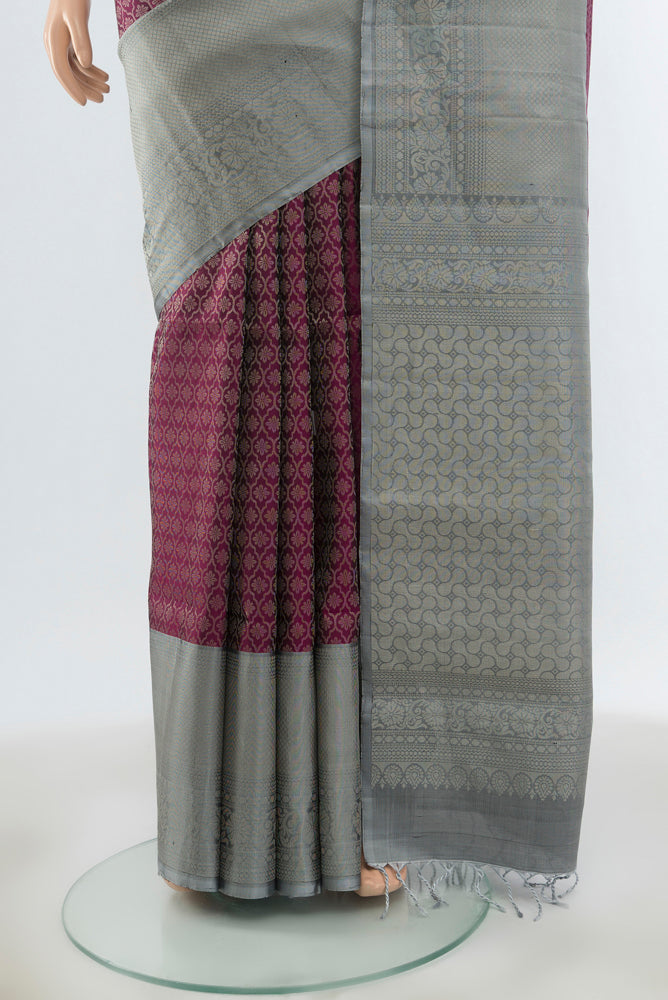 Pleats and pallu of Purple Soft Silk Saree with Zari Butta on the body and Silk Border. 